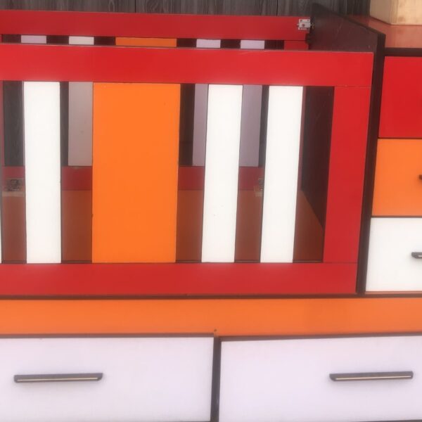 Baby cot with drawers and shelves